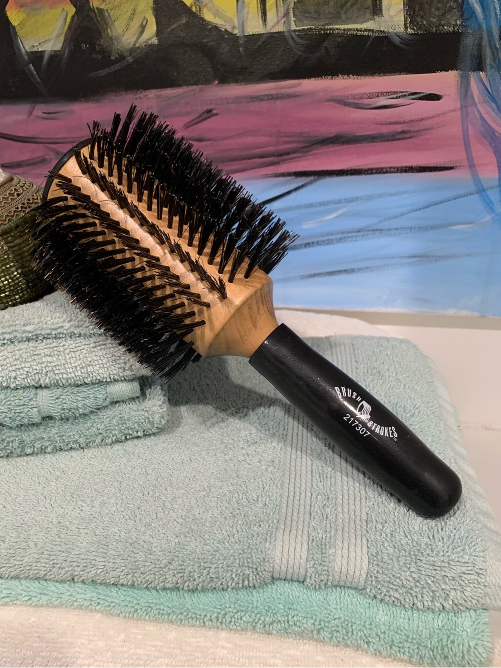 Brush strokes brand Round Bristle Hair Brush. Black Handle, Natural Wood Barrel